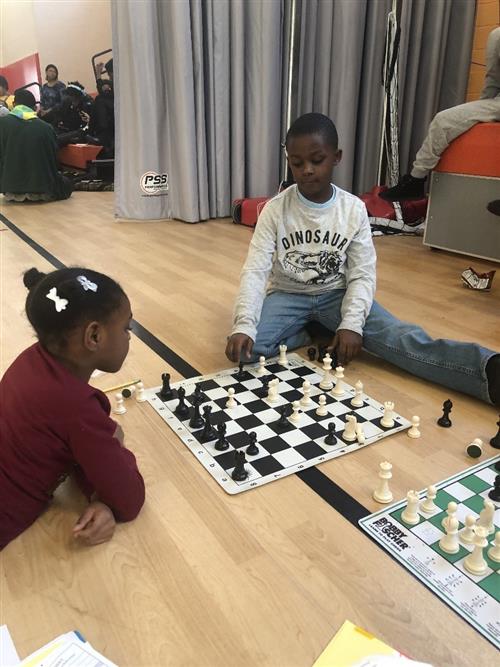 Chess practice at vernor. Two students challenging each other